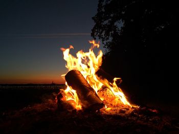 Bonfire on field at night