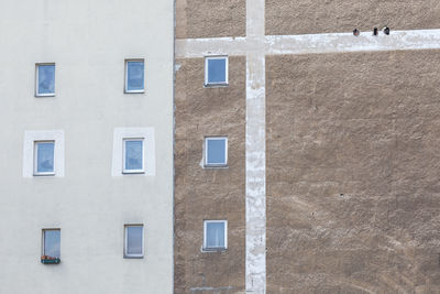 Full frame shot of illegal windows on  a fire protecting wall of a building ordered in square shape