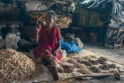 Midsection of woman working at market stall