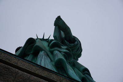 Low angle view of statue against clear sky