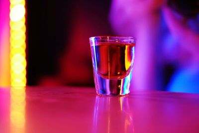 Close-up of tequila served on table