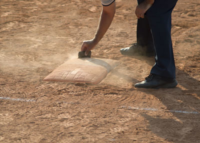 Low section of men standing on field