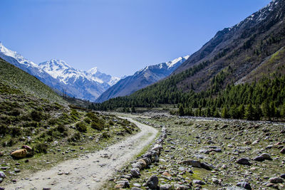 Scenic view of mountains against clear blue sky