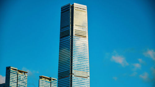 Low angle view of modern buildings against clear blue sky