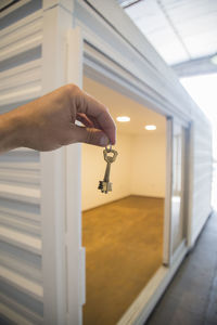 Low section of man with arms raised