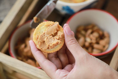 Close-up of hand holding ice cream