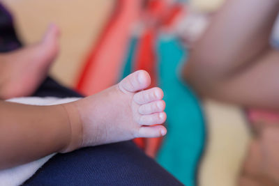 Low section of baby feet