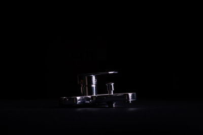 Close-up of coffee on table against black background