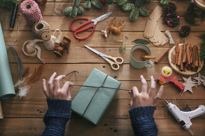 Woman wrapping christmas gifts