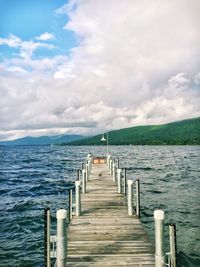 Pier over sea against sky