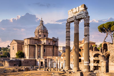 Buildings in city santo luca church in roma forum with curia iulia 