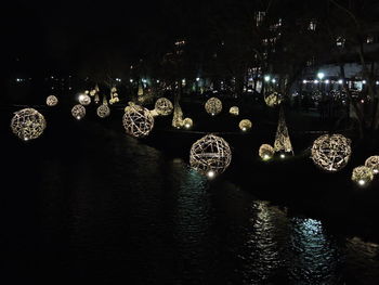 Illuminated lighting equipment hanging at night