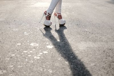 Low section of woman standing on floor