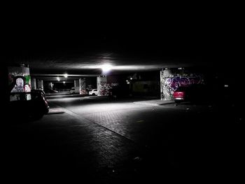 Car on illuminated street at night