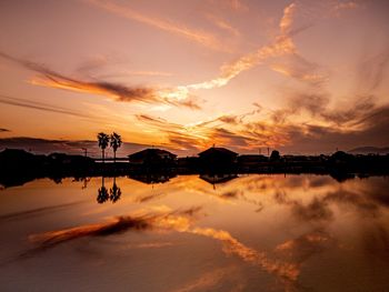 Scenic view of lake against sky during sunset