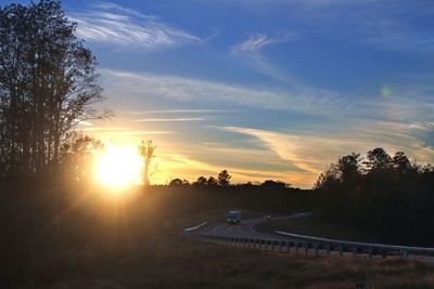 Scenic view of landscape against sky at sunset