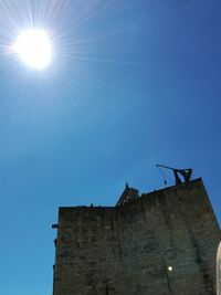 Low angle view of building against blue sky