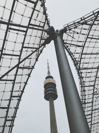 Low angle view of communications tower against sky