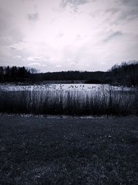 Scenic view of landscape against sky during winter