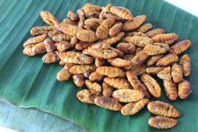 High angle view of roasted coffee beans on table