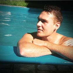 High angle view of shirtless man in swimming pool