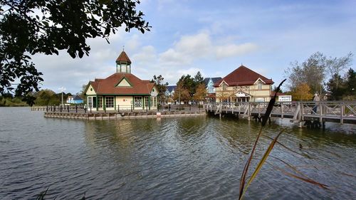 Gazebo by trees against sky