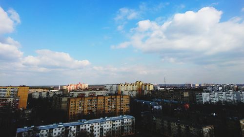 High angle view of buildings in city against sky