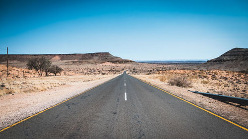 Road amidst landscape against clear sky