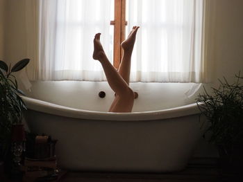 Young woman in bathroom at home