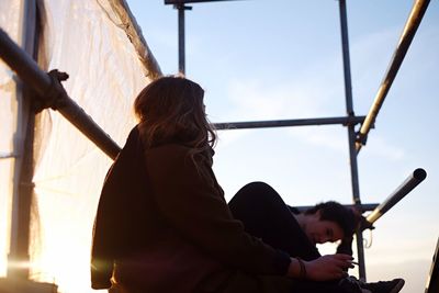 Low angle view of woman against sky