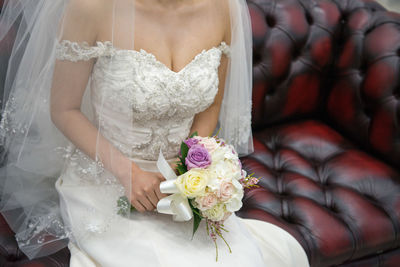 Close-up of woman holding bouquet