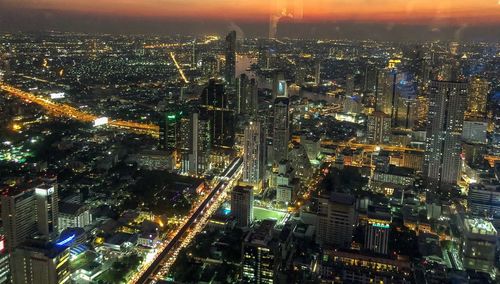 High angle view of illuminated cityscape at night