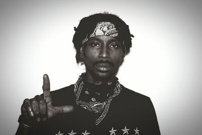 Portrait of young man against white background