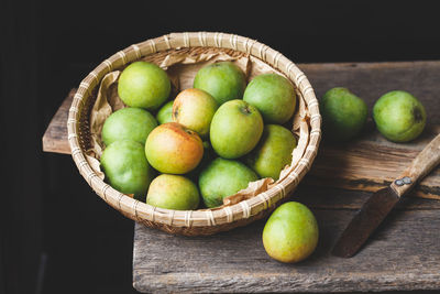 High angle view of fruits in basket on table