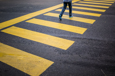 Person walling on zebra crossing