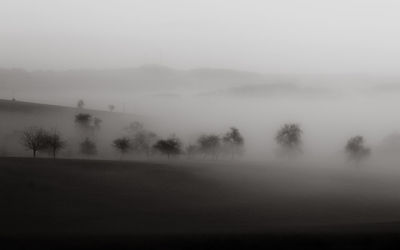 Scenic view of landscape in foggy weather