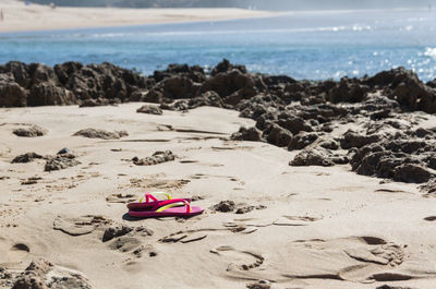 Close-up of sand on beach against sky