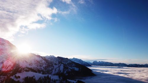 Scenic view of snowcapped mountains against sky