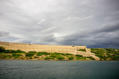 View of castle against cloudy sky