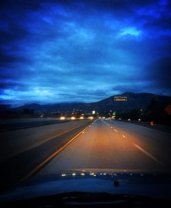 Illuminated road at night