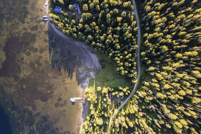 Aerial view of a road next to lake.