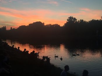 Scenic view of lake at sunset