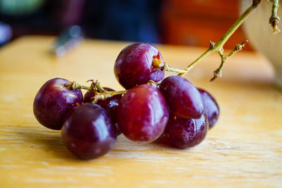 Close-up of grapes on table