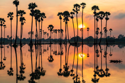 Scenic view of lake against sky during sunset