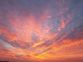 Low angle view of dramatic sky during sunset