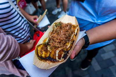 Close-up of person holding food