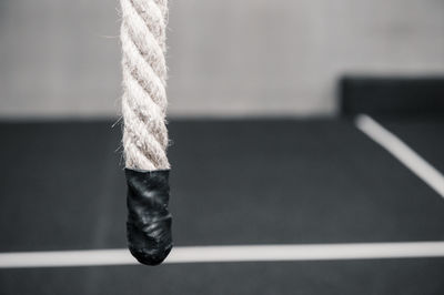 Close-up of rope tied up on metal railing