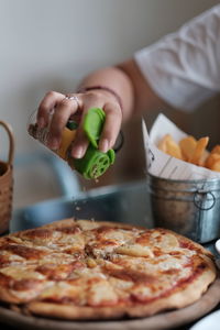 Midsection of woman preparing food