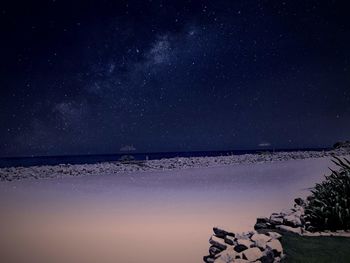 Scenic view of sea against sky at night