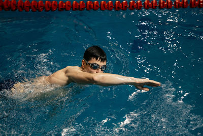 High angle view of man swimming in pool